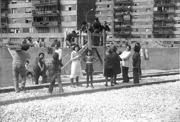 What are these people doing in the photograph? Who are they? Could this scene be part of 'Bellvitge live role-playing?'